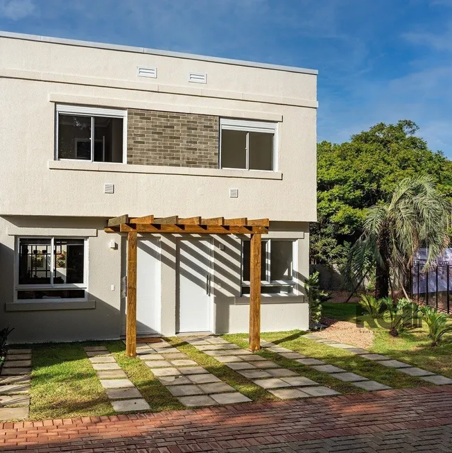 Foto 1 de Casa de Condomínio com 2 Quartos à venda, 86m² em Vila Nova, Porto Alegre