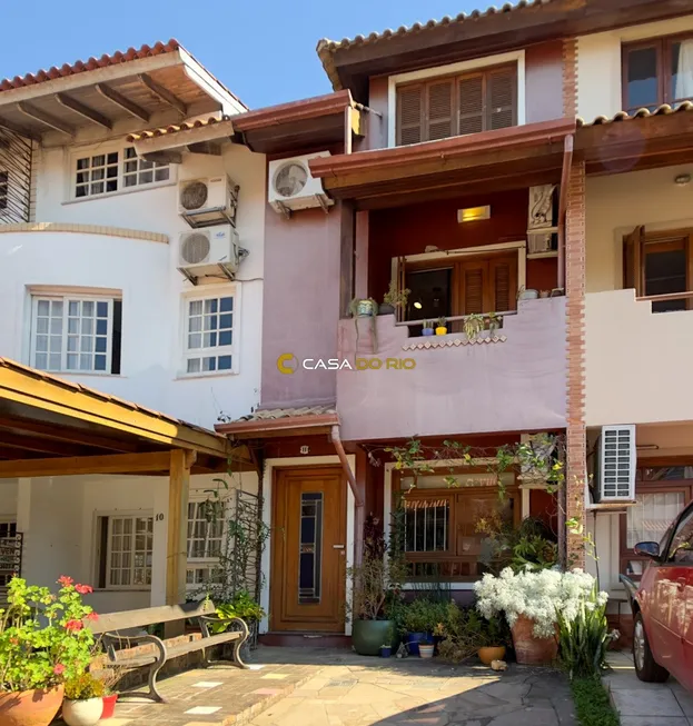 Foto 1 de Casa de Condomínio com 4 Quartos à venda, 134m² em Cavalhada, Porto Alegre