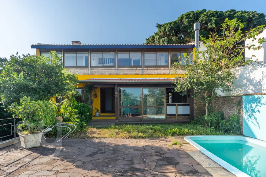 Foto 1 de Casa com 5 Quartos para venda ou aluguel, 584m² em Vila Assunção, Porto Alegre