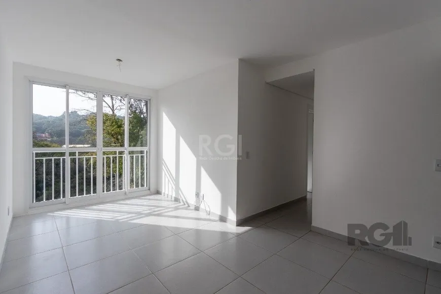 Foto 1 de Apartamento com 2 Quartos à venda, 59m² em Vila Nova, Porto Alegre