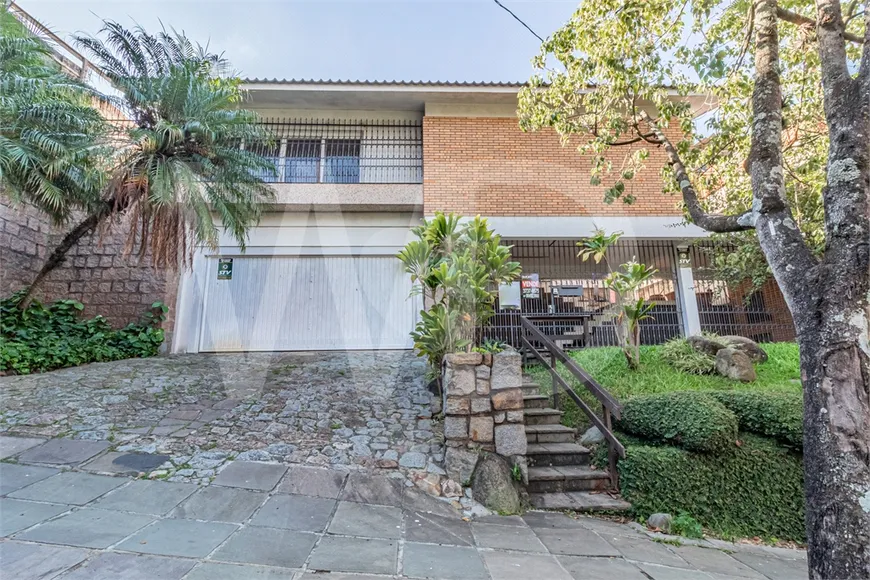 Foto 1 de Casa com 3 Quartos à venda, 320m² em Rio Branco, Porto Alegre