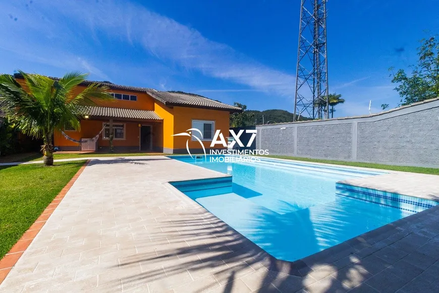 Foto 1 de Casa de Condomínio com 4 Quartos à venda, 226m² em Tabatinga, Caraguatatuba