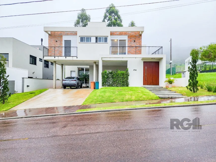 Foto 1 de Casa de Condomínio com 3 Quartos à venda, 285m² em Alphaville, Porto Alegre