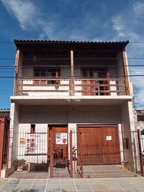 Foto 1 de Casa com 4 Quartos à venda, 140m² em Parque dos Maias, Porto Alegre