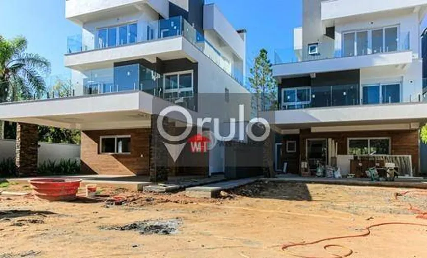 Foto 1 de Casa de Condomínio com 4 Quartos à venda, 300m² em Pedra Redonda, Porto Alegre