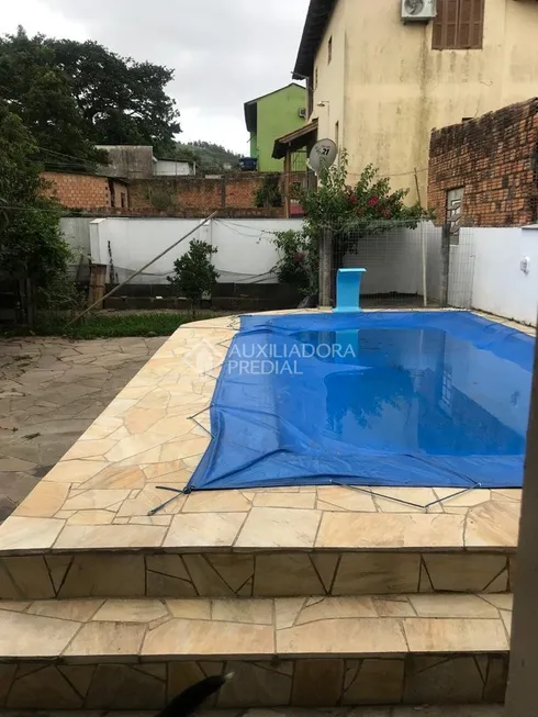 Foto 1 de Casa com 3 Quartos à venda, 160m² em Jardim Universitario, Viamão