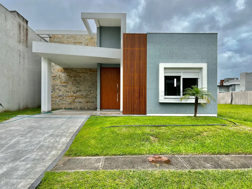 Foto 1 de Casa de Condomínio com 4 Quartos à venda, 180m² em Santa Luzia, Capão da Canoa