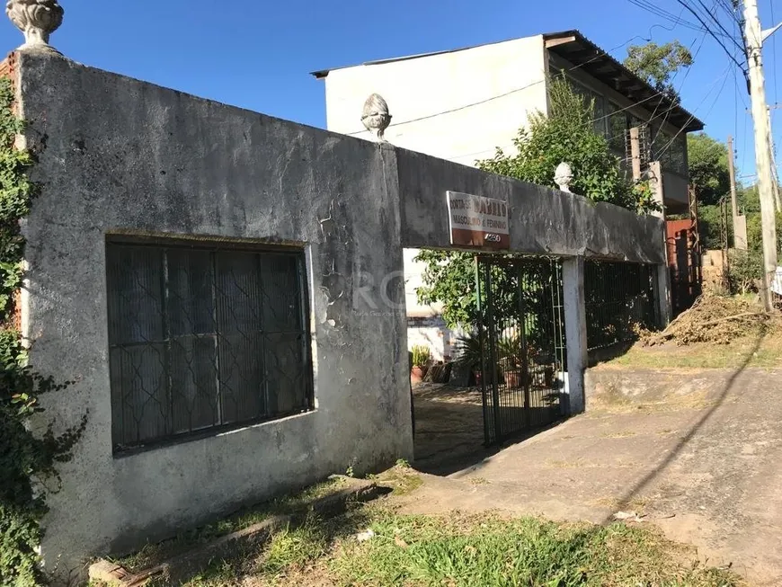 Foto 1 de Casa com 4 Quartos à venda, 101m² em Vila Nova, Porto Alegre