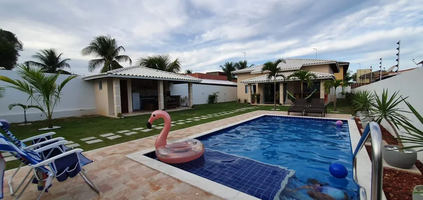 Foto 1 de Casa de Condomínio com 4 Quartos à venda, 198m² em Barra do Jacuípe, Camaçari