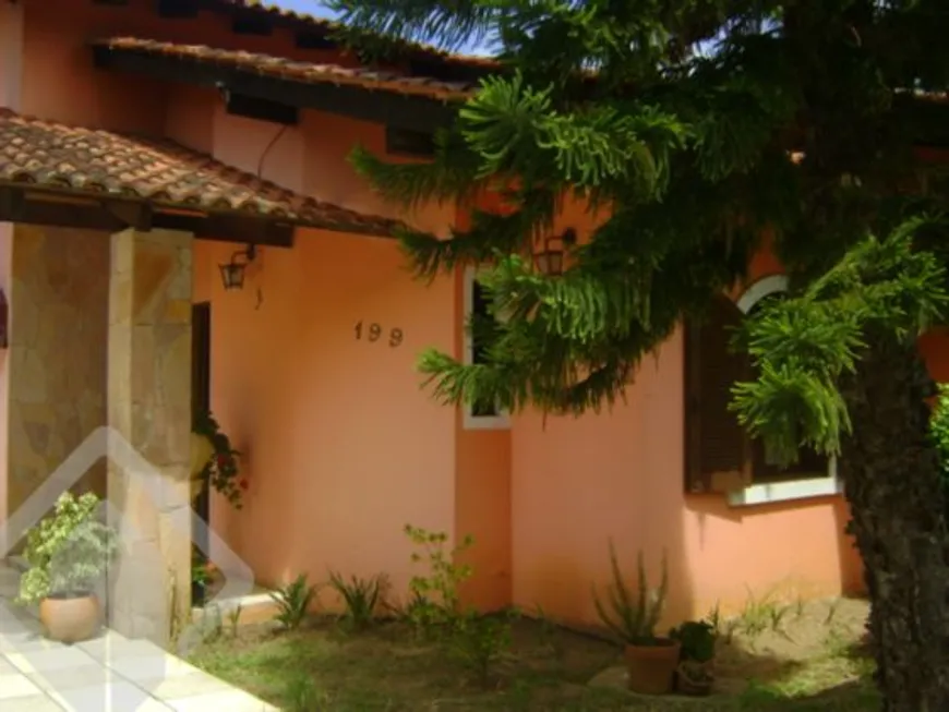 Foto 1 de Casa com 4 Quartos à venda, 226m² em Guarujá, Porto Alegre