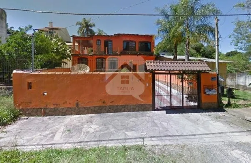 Foto 1 de Casa com 5 Quartos à venda, 260m² em Tarumã, Viamão