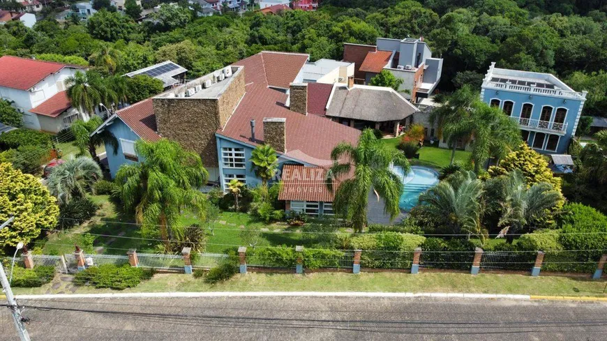 Foto 1 de Casa de Condomínio com 5 Quartos à venda, 637m² em Condominio Cantegril, Viamão