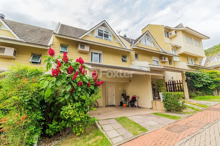 Foto 1 de Casa de Condomínio com 3 Quartos à venda, 182m² em Teresópolis, Porto Alegre