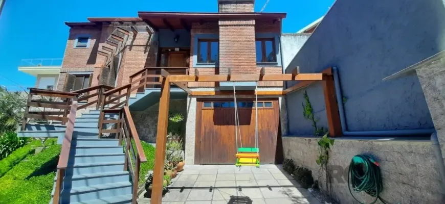 Foto 1 de Casa de Condomínio com 4 Quartos à venda, 245m² em Agronomia, Porto Alegre