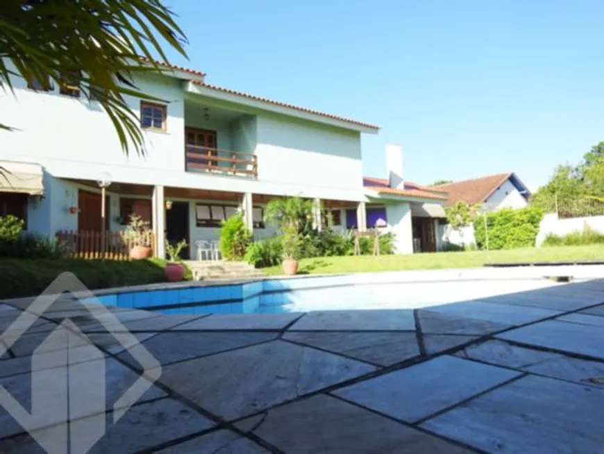 Foto 1 de Casa com 4 Quartos à venda, 460m² em Vila Assunção, Porto Alegre