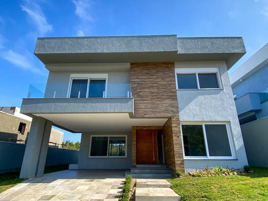 Foto 1 de Casa de Condomínio com 4 Quartos à venda, 255m² em Vila Nova, Porto Alegre