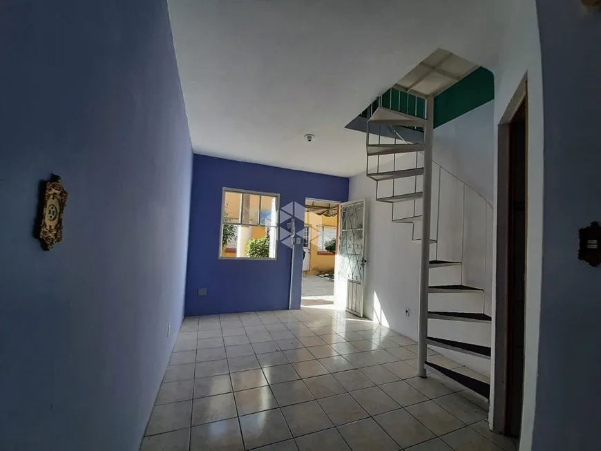Foto 1 de Casa de Condomínio com 2 Quartos à venda, 36m² em Santo Antônio, Porto Alegre