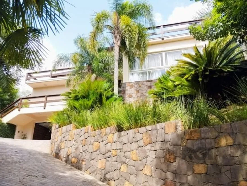 Foto 1 de Casa de Condomínio com 6 Quartos para alugar, 452m² em Cavalhada, Porto Alegre