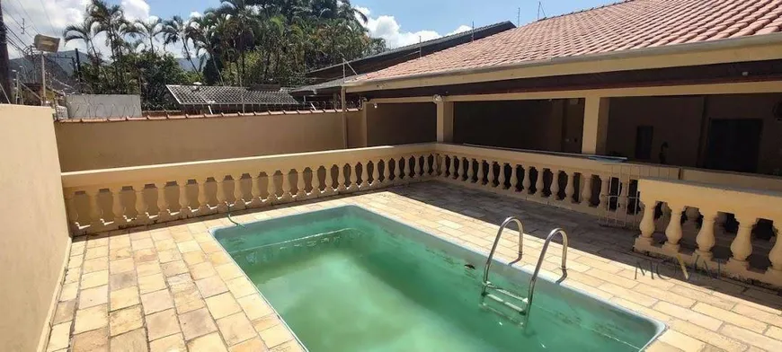 Foto 1 de Casa com 5 Quartos à venda, 242m² em Martim de Sa, Caraguatatuba