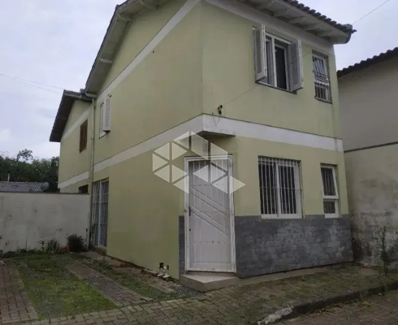 Foto 1 de Casa de Condomínio com 2 Quartos à venda, 56m² em Tarumã, Viamão