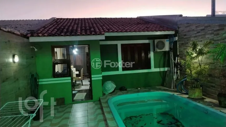 Foto 1 de Casa com 2 Quartos à venda, 57m² em Guajuviras, Canoas