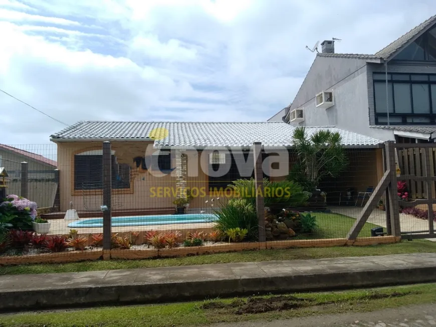 Foto 1 de Casa com 6 Quartos à venda, 372m² em Zona Nova, Tramandaí
