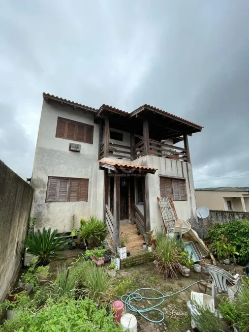 Foto 1 de Casa com 6 Quartos à venda, 401m² em Partenon, Porto Alegre