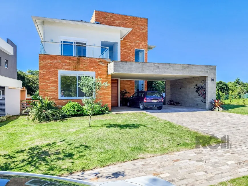 Foto 1 de Casa de Condomínio com 4 Quartos à venda, 273m² em Alphaville, Porto Alegre