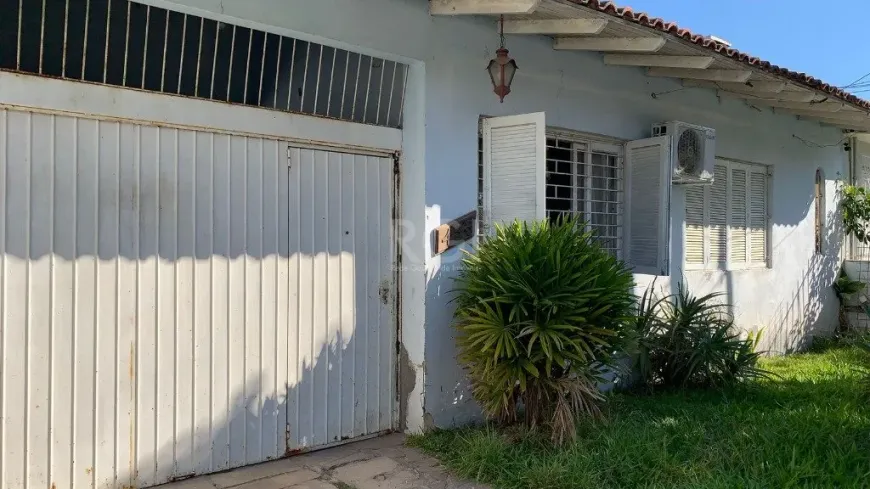 Foto 1 de Casa com 4 Quartos à venda, 179m² em Cavalhada, Porto Alegre