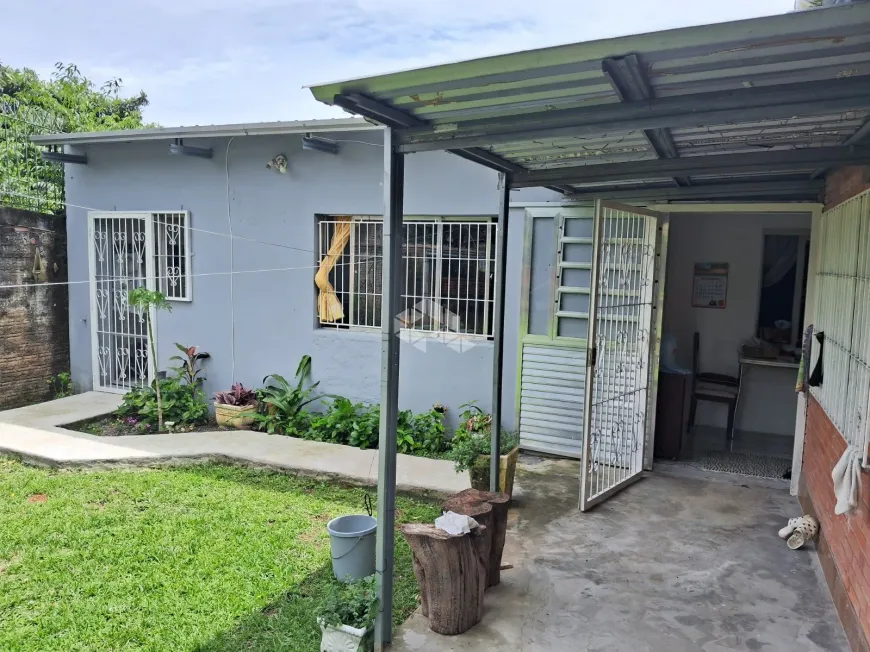 Foto 1 de Casa com 2 Quartos à venda, 80m² em Vila Nova, Porto Alegre