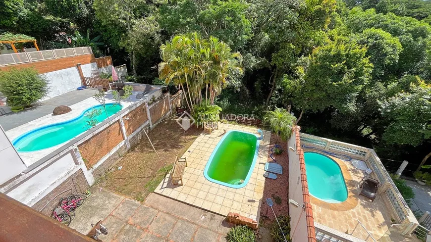 Foto 1 de Casa de Condomínio com 3 Quartos à venda, 320m² em Vila Nova, Porto Alegre