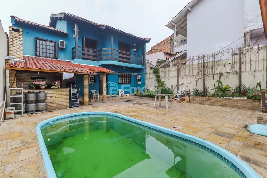Foto 1 de Casa com 3 Quartos à venda, 260m² em Santa Fé, Porto Alegre