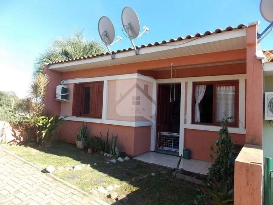 Foto 1 de Casa de Condomínio com 2 Quartos à venda, 52m² em São Tomé, Viamão