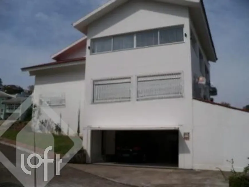 Foto 1 de Casa de Condomínio com 3 Quartos à venda, 340m² em Vila Nova, Porto Alegre