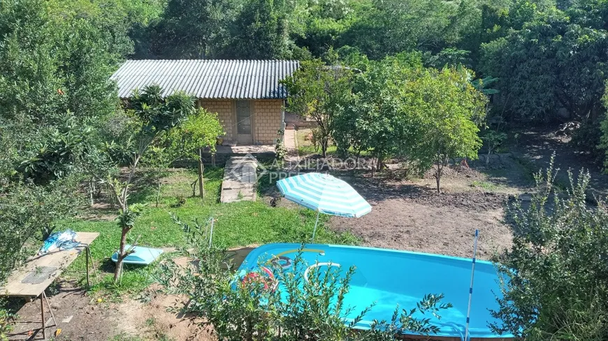 Foto 1 de Casa com 3 Quartos à venda, 322m² em Vila Nova, Porto Alegre