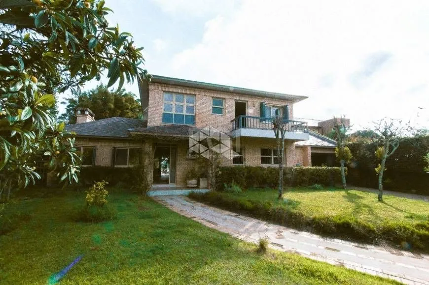 Foto 1 de Casa com 3 Quartos à venda, 399m² em Arquipélago, Porto Alegre