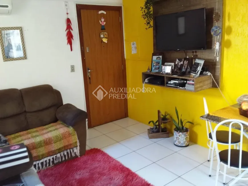 Foto 1 de Apartamento com 2 Quartos à venda, 38m² em Vila Nova, Porto Alegre