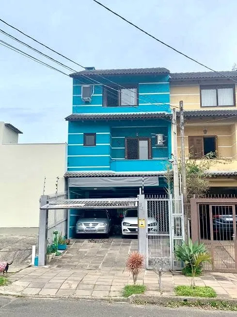 Foto 1 de Sobrado com 4 Quartos à venda, 189m² em Guarujá, Porto Alegre