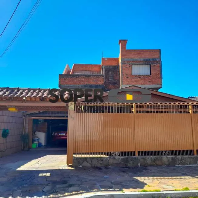 Foto 1 de Casa com 5 Quartos à venda, 231m² em Vila Nova, Porto Alegre