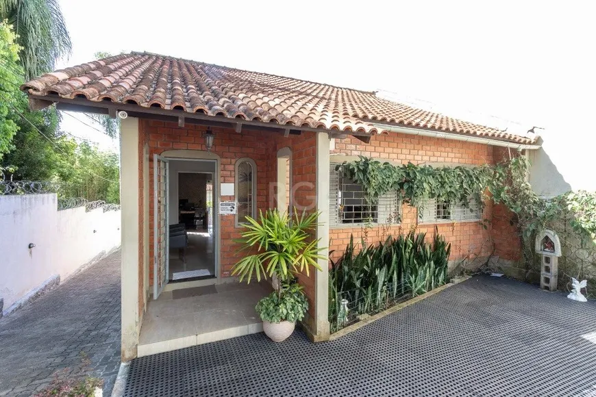 Foto 1 de Casa com 5 Quartos à venda, 198m² em Tristeza, Porto Alegre