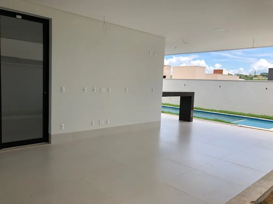 Foto 1 de Casa de Condomínio com 4 Quartos à venda, 305m² em Jardins Valencia, Goiânia