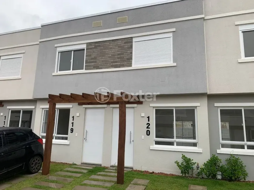 Foto 1 de Casa de Condomínio com 2 Quartos à venda, 57m² em Vila Nova, Porto Alegre