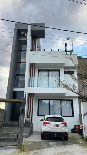 Foto 1 de Casa de Condomínio com 4 Quartos à venda, 239m² em Lomba do Pinheiro, Porto Alegre