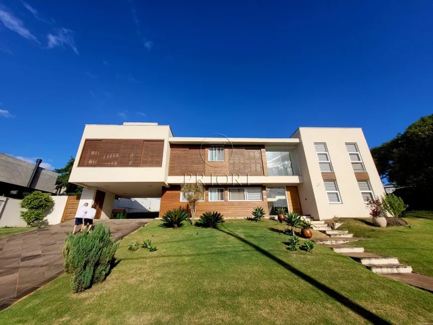 Foto 1 de Casa de Condomínio com 4 Quartos para venda ou aluguel, 309m² em Vila Nova, Porto Alegre