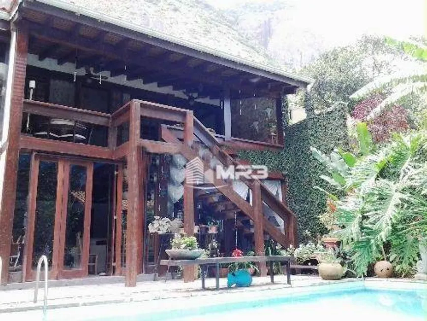 Foto 1 de Casa com 5 Quartos à venda, 330m² em Barra da Tijuca, Rio de Janeiro