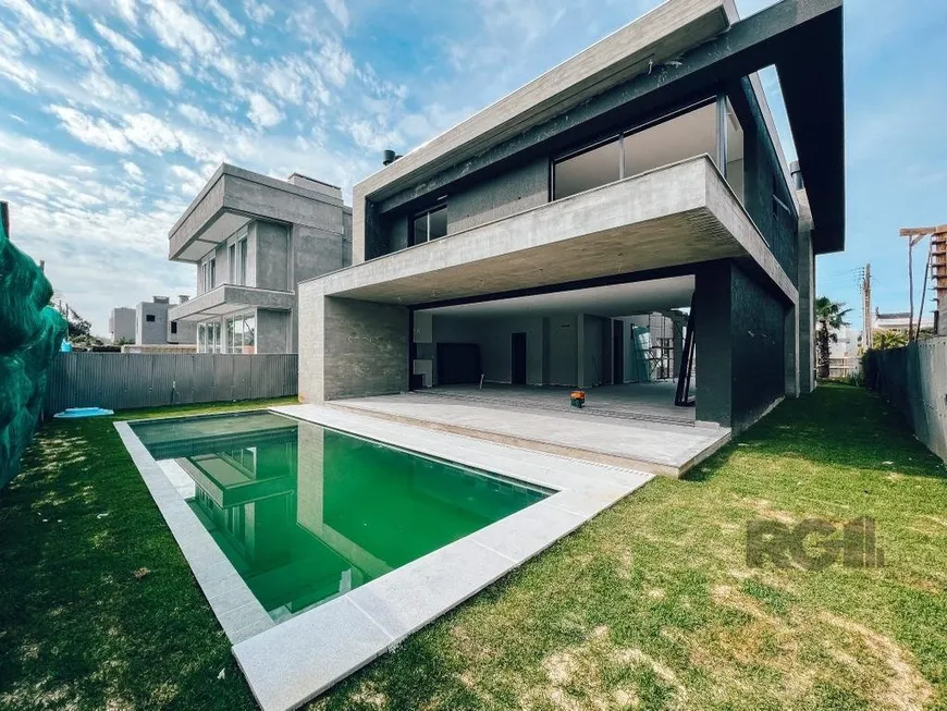 Foto 1 de Casa de Condomínio com 5 Quartos à venda, 336m² em Velas da Marina, Capão da Canoa