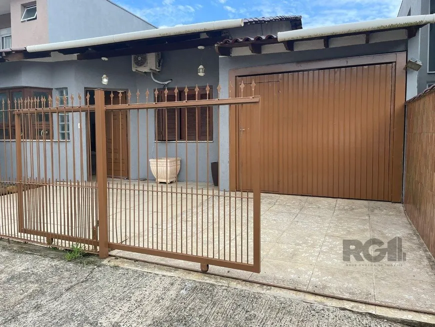 Foto 1 de Casa com 2 Quartos à venda, 104m² em Vila Nova, Porto Alegre