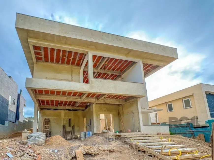 Foto 1 de Casa de Condomínio com 4 Quartos à venda, 265m² em Alphaville, Porto Alegre