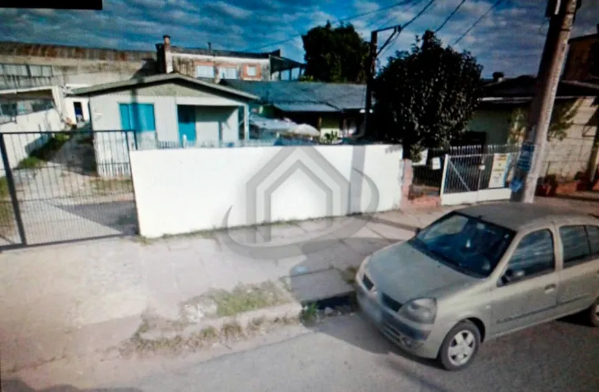 Foto 1 de Casa com 11 Quartos à venda, 429m² em Vila Nova, Porto Alegre