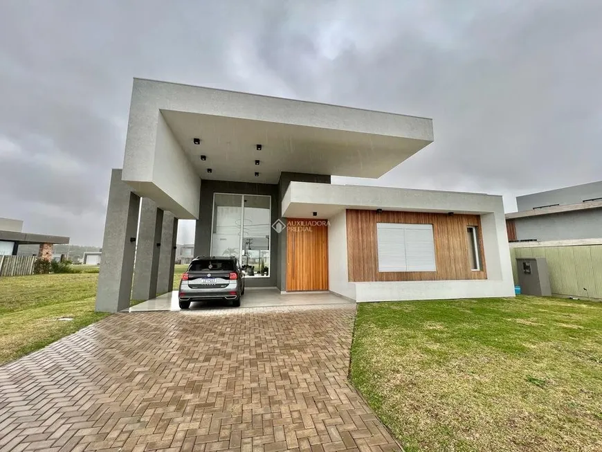 Foto 1 de Casa de Condomínio com 4 Quartos à venda, 247m² em Capao Novo, Capão da Canoa